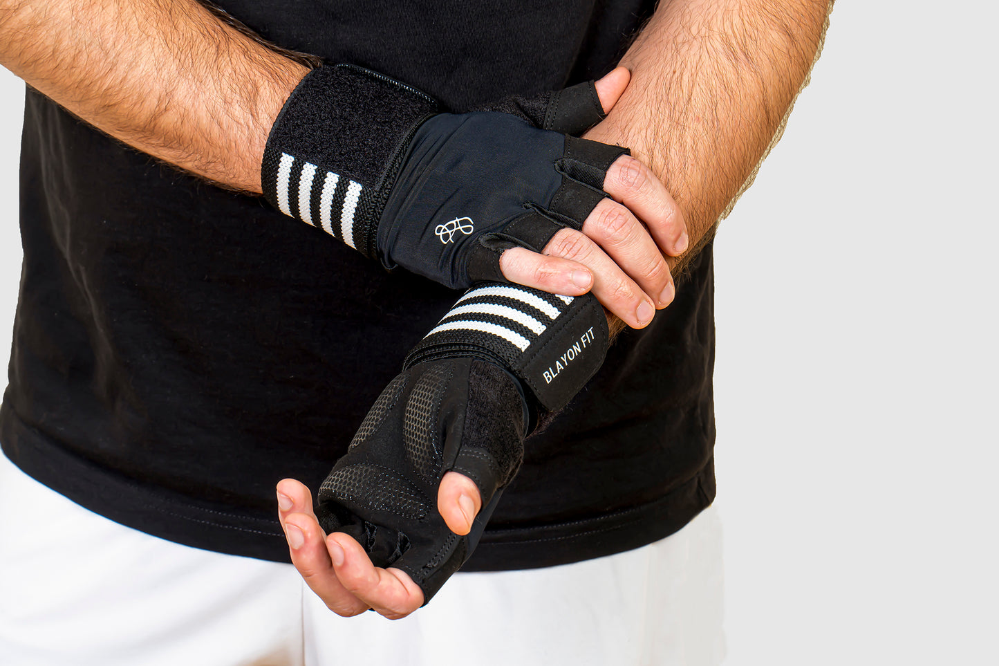 men wearing a high quality gym weightlifting gloves that has a wrist support.  